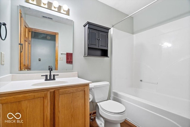 full bathroom featuring visible vents, shower / bathtub combination, toilet, and vanity