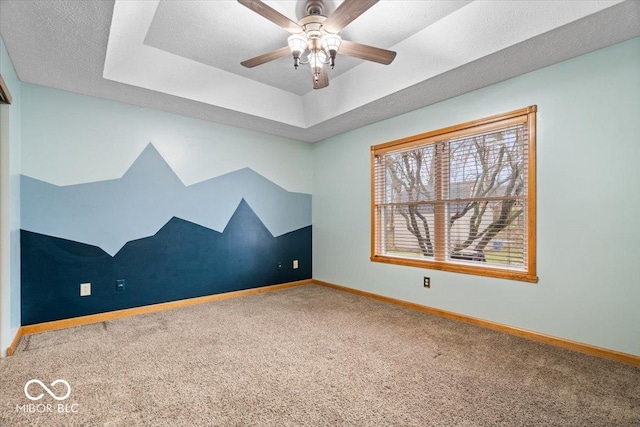 bonus room featuring ceiling fan, carpet, baseboards, and a textured ceiling