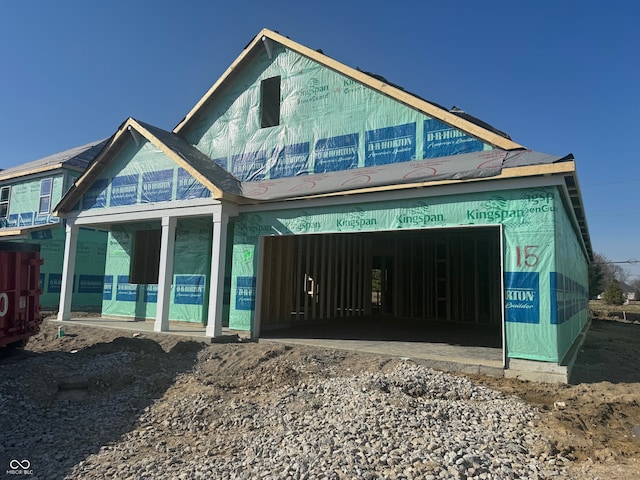 unfinished property featuring a garage