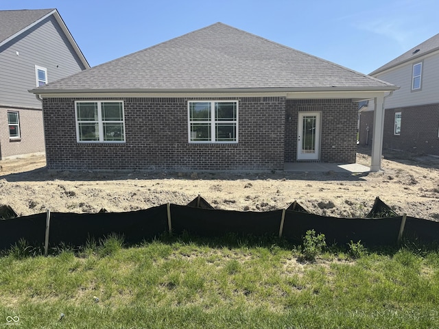 1366 Foxtail Ln, Greenwood, IN 46143 - rear view of house with brick siding, a shingled roof, and a patio area