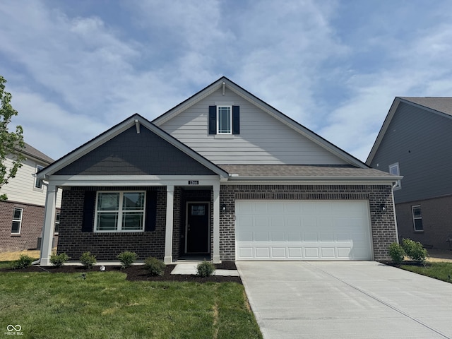 1366 Foxtail Ln, Greenwood, IN 46143 - view of front of property with brick siding, driveway, a garage, and a front lawn