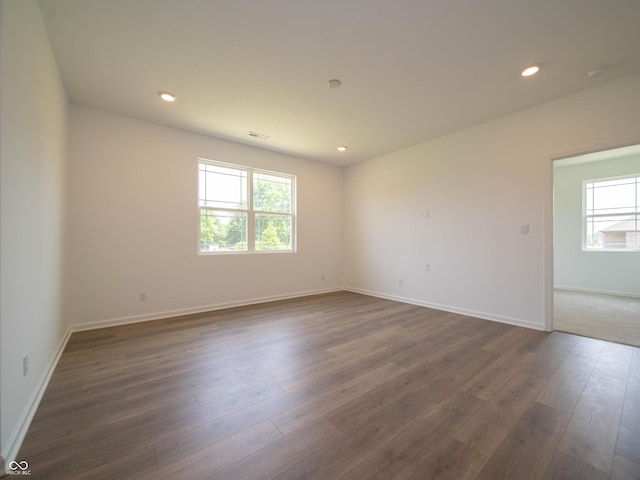 1366 Foxtail Ln, Greenwood, IN 46143 - unfurnished room with dark wood-style flooring, recessed lighting, and a smoke detector