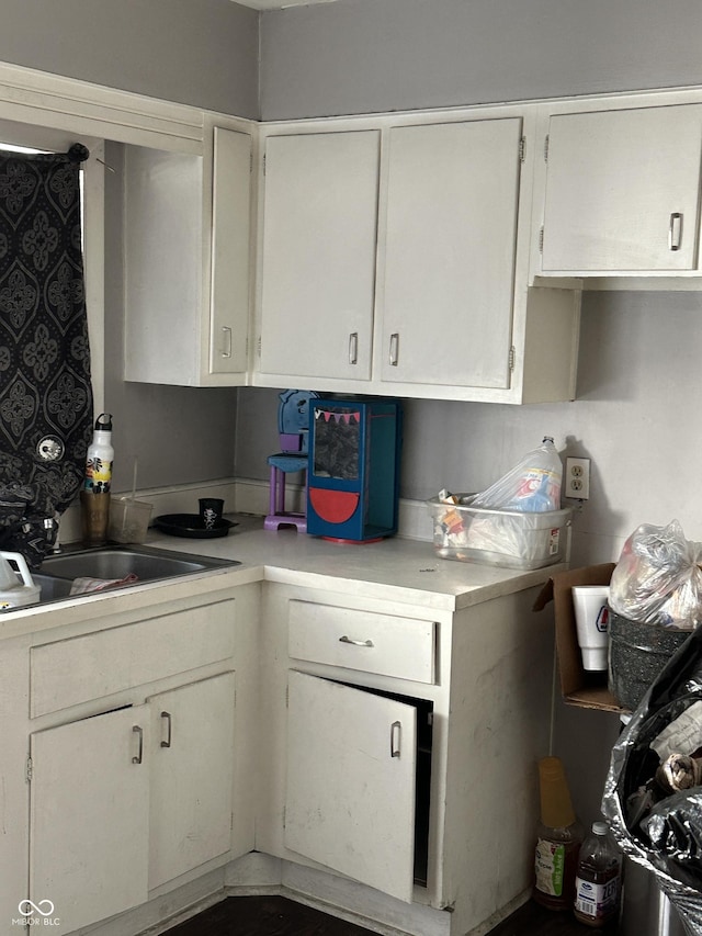 kitchen featuring white cabinets and light countertops