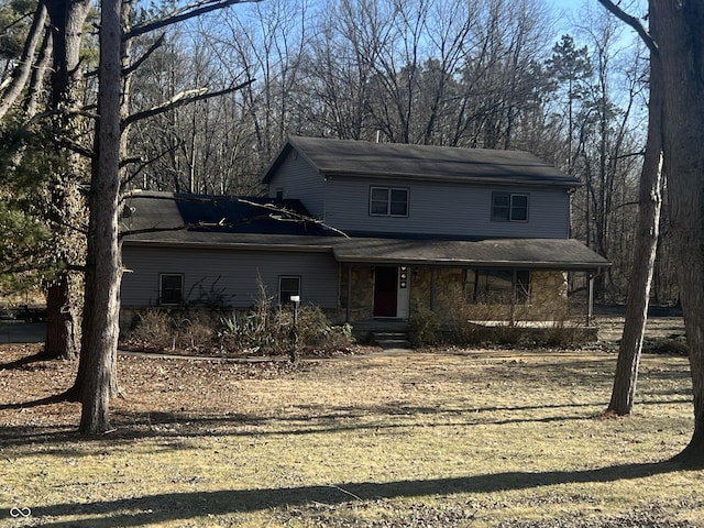 view of front of property with covered porch and stone siding