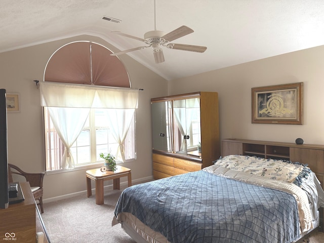 bedroom featuring visible vents, baseboards, a ceiling fan, carpet, and vaulted ceiling