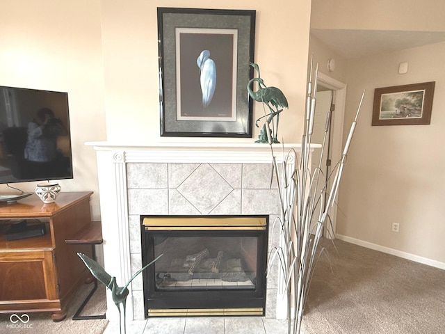 room details featuring carpet, a fireplace, and baseboards