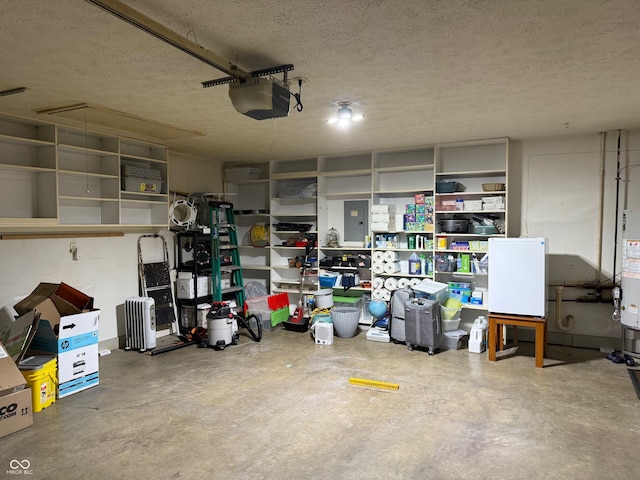 garage with water heater and a garage door opener