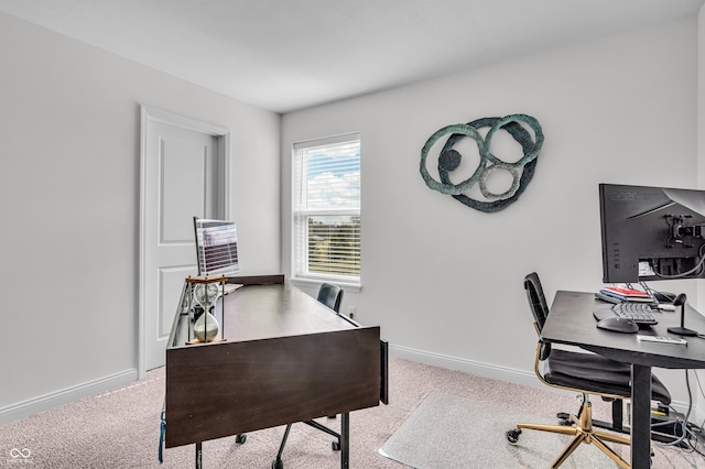 office space with baseboards and carpet