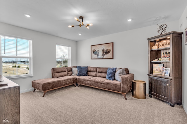 living room with a chandelier, recessed lighting, light colored carpet, and baseboards