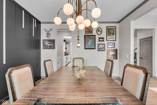 dining area featuring wood finished floors and baseboards