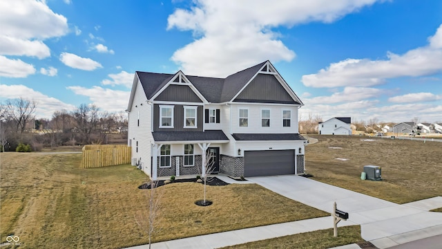 view of front facade with an attached garage, board and batten siding, concrete driveway, and a front lawn