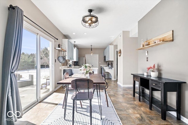 dining room featuring baseboards