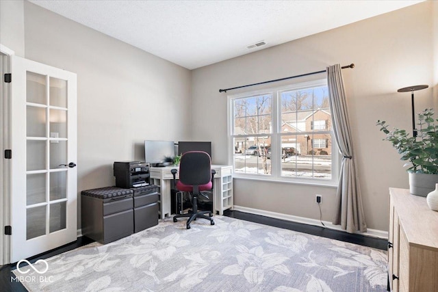 office featuring visible vents and baseboards