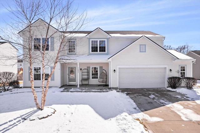 view of front of home featuring an attached garage and covered porch