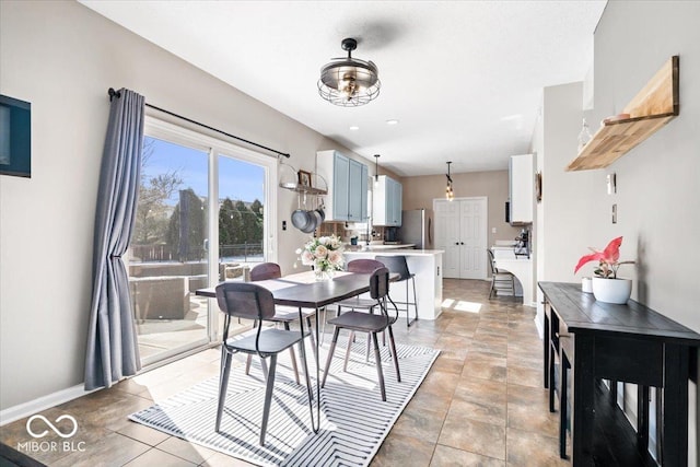 dining room featuring baseboards