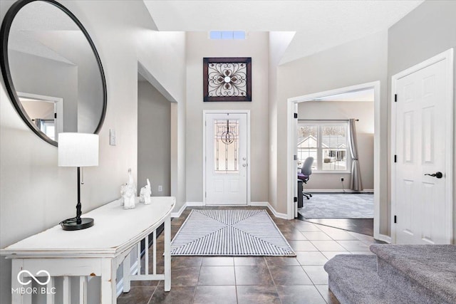 entryway with tile patterned flooring, visible vents, and baseboards