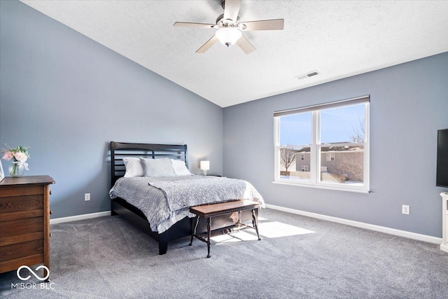 carpeted bedroom featuring visible vents, vaulted ceiling, a textured ceiling, and baseboards