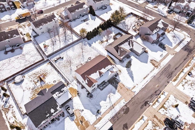 snowy aerial view with a residential view