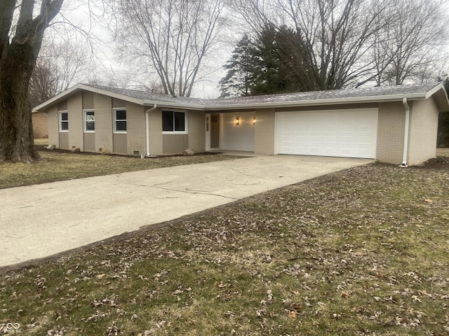 ranch-style house featuring driveway, brick siding, and an attached garage