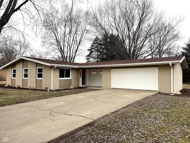 ranch-style house featuring a garage, driveway, and brick siding