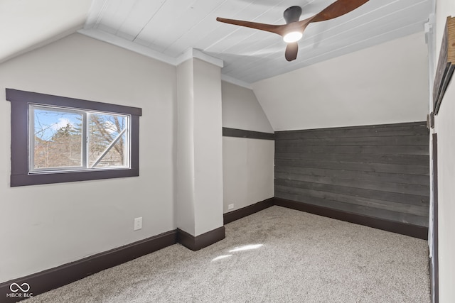 bonus room with lofted ceiling, ceiling fan, baseboards, and carpet flooring