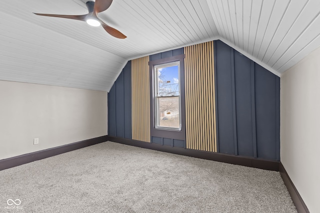 bonus room featuring a ceiling fan, lofted ceiling, carpet flooring, and baseboards