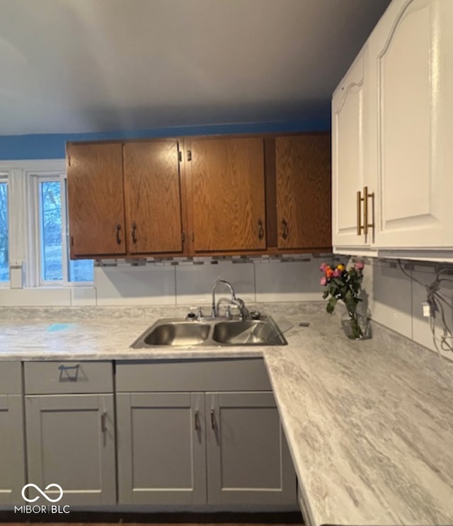 kitchen with light countertops and a sink