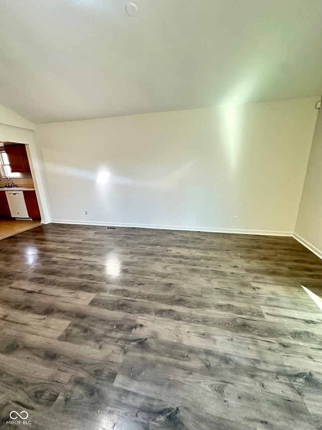 unfurnished room featuring dark wood-style floors and baseboards