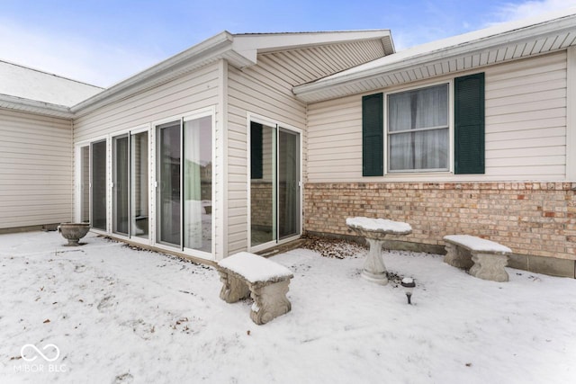 exterior space featuring brick siding