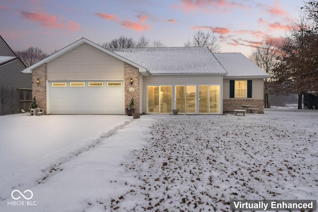 ranch-style house with brick siding and an attached garage