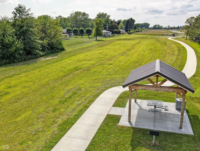 view of community with a patio, a lawn, and a gazebo