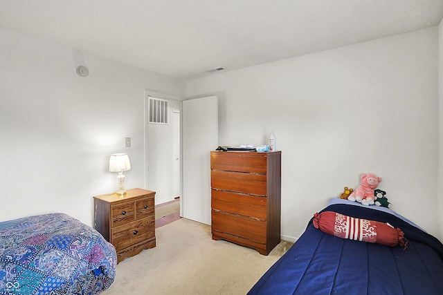 bedroom featuring carpet and visible vents