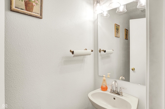 bathroom featuring a sink and visible vents