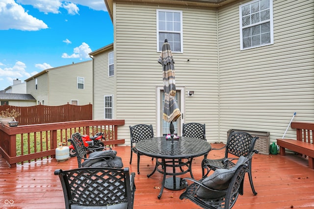 wooden deck featuring outdoor dining space