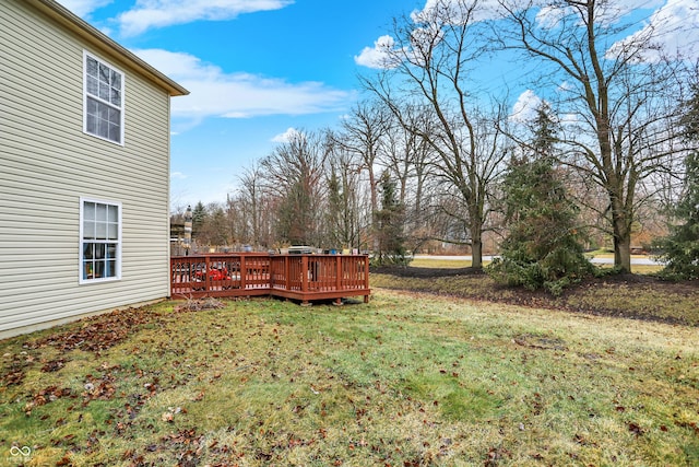 view of yard with a wooden deck