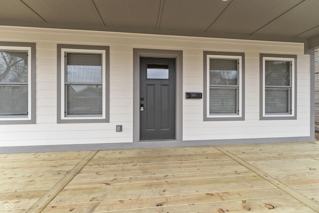 doorway to property featuring covered porch