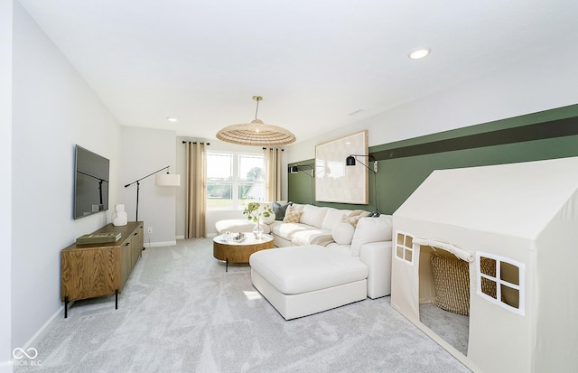 living room featuring recessed lighting, light carpet, and baseboards