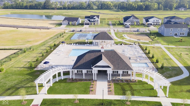 aerial view featuring a water view and a residential view