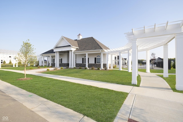 view of front of home with roof with shingles, a front yard, fence, and a pergola