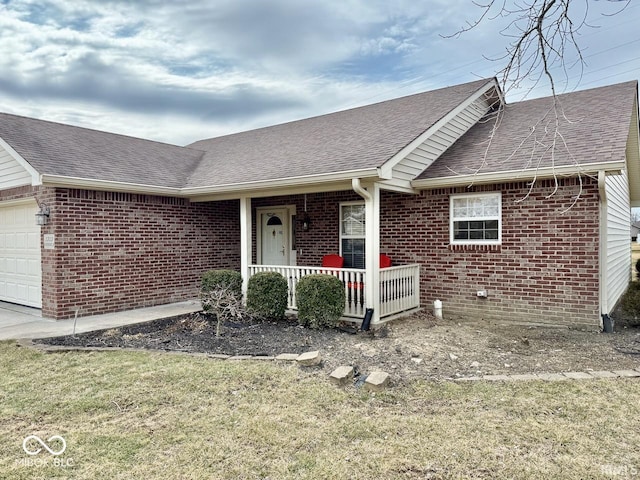 view of front of home featuring brick siding, roof with shingles, covered porch, an attached garage, and a front lawn