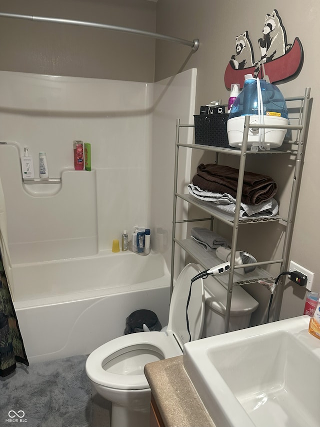 full bathroom featuring toilet, shower / bathing tub combination, and a sink