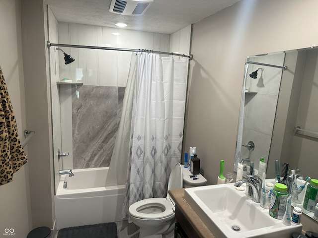 full bathroom featuring visible vents, shower / bath combo with shower curtain, toilet, a textured ceiling, and vanity