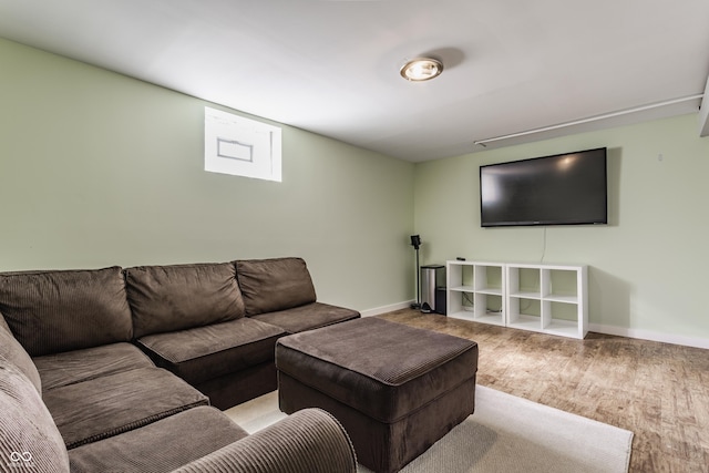 living room with baseboards and wood finished floors