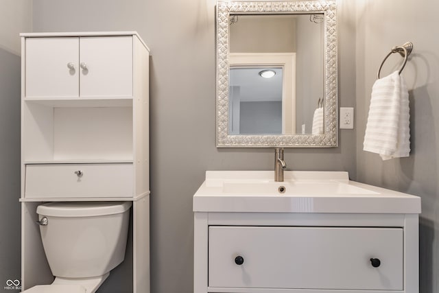 half bath with toilet and vanity