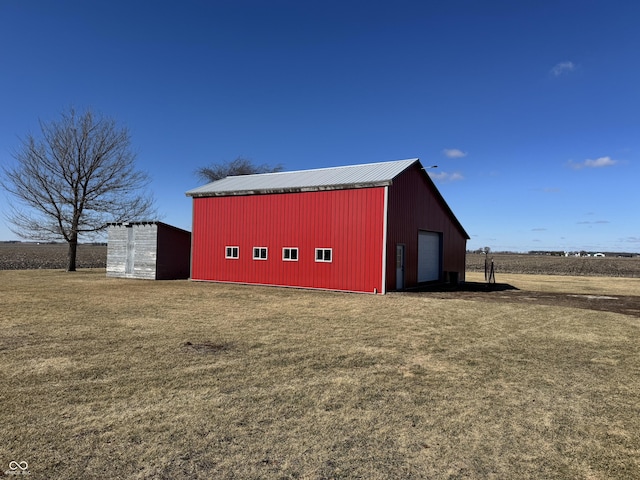 view of pole building with a yard