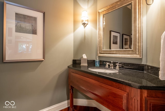 bathroom with vanity and baseboards