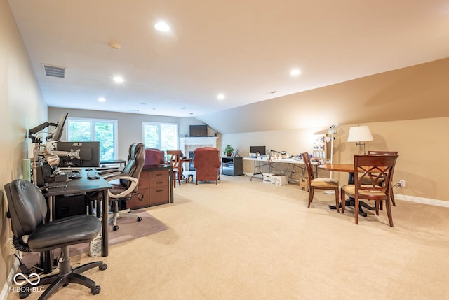 office with recessed lighting, lofted ceiling, and light colored carpet