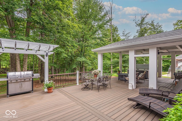 wooden deck featuring outdoor dining area, area for grilling, and a pergola