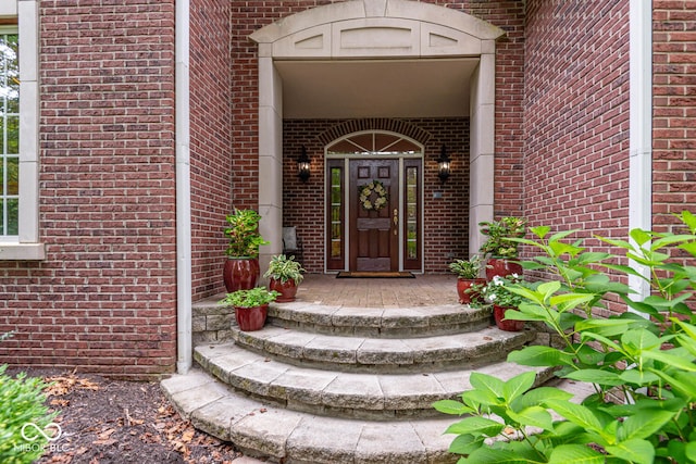 property entrance with brick siding