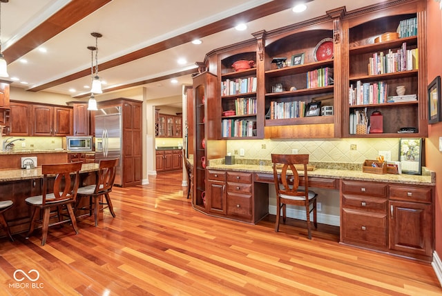 office area with beam ceiling, a sink, recessed lighting, light wood finished floors, and built in study area